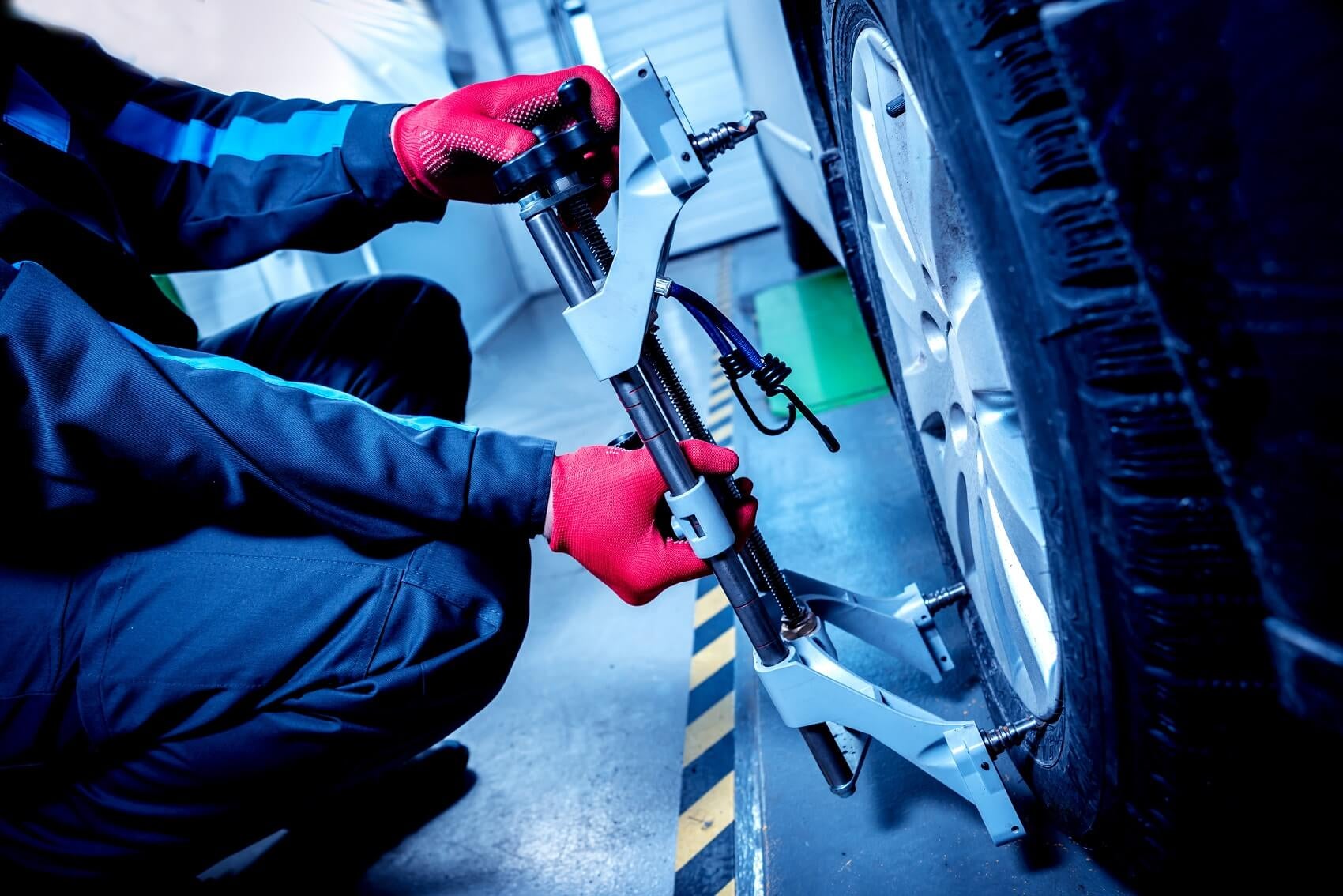 chevy mechanic checks tire pressure at chevy service center