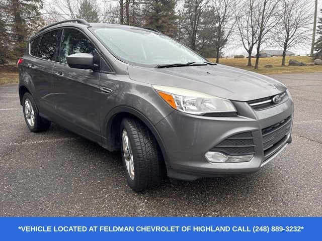 Used 2014 Ford Escape SE with VIN 1FMCU0GX5EUC17995 for sale in Highland Charter Township, MI