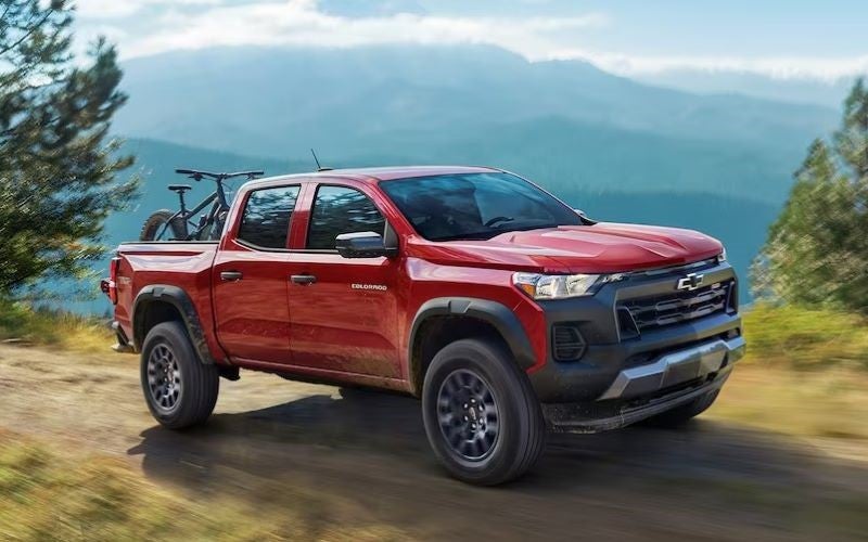 Used Red Chevy Colorado on trail